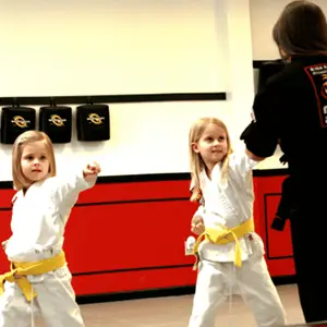 young students doing martial arts